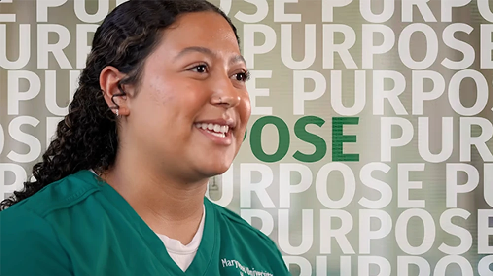 nursing student smiling with purpose written in background - video thumbnail