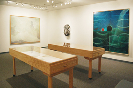 A room with art exhibits and other pieces