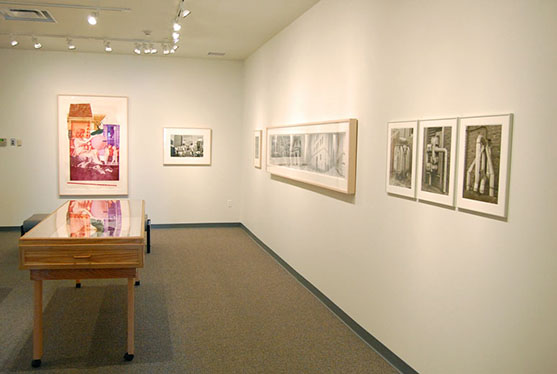 A room filled with paintings and other art exhibits.